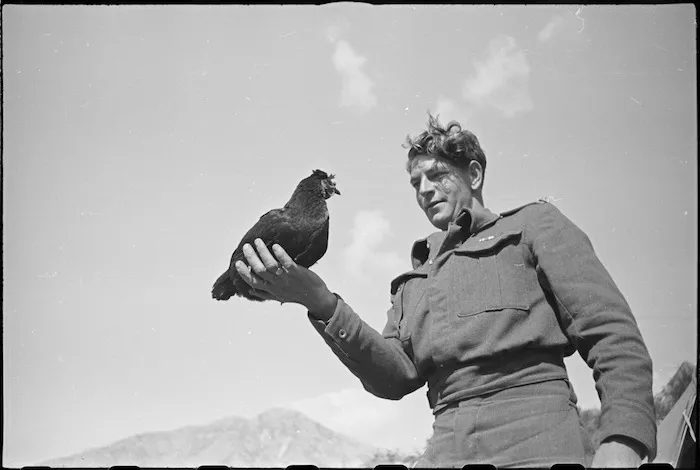 M Batistich with Lulu, the hen mascot of 6 Field Main Dressing Station, Italy, World War II - Photograph taken by George Kaye