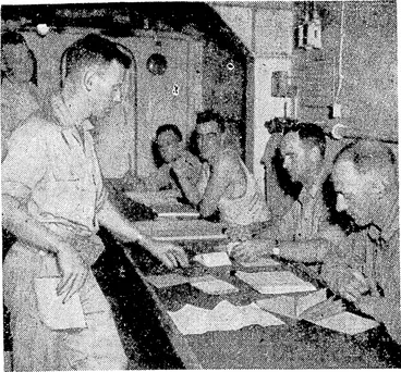 Image: Men of the New Zealand Third Division voting in the recent General Election on the way from Guadalcanal to Vella Lavella. The two principal polling officers are Major G. B. Gibbons (Wellington) and Major H. F. Allan (Nelson). (Evening Post, 15 October 1943)