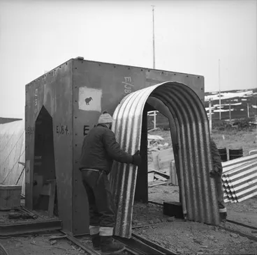 Image: The corrugated iron covered way, used to connect separate buildings, being erected