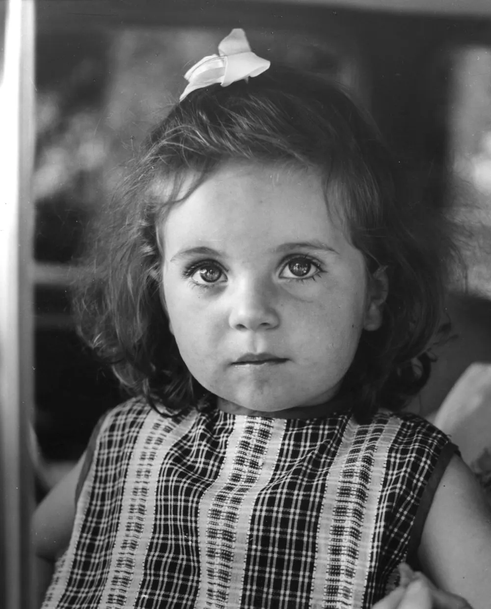 Quinn's Post Christmas party; young girl with ribbon in hair.