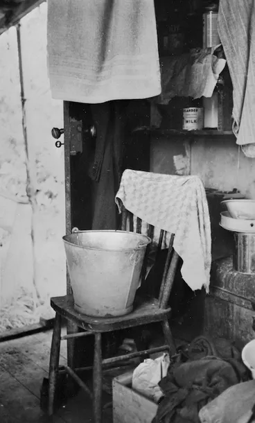 Image: Interior of Frank Sargeson's bach at Esmonde Road, Takapuna, Auckland; includes a bucket and towels