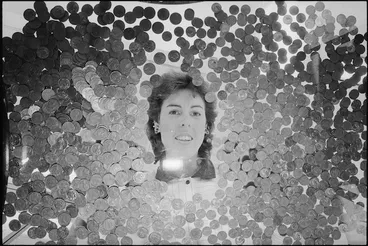 Image: Catherine Hodgins of the Reserve Bank and some of the copper coins removed from circulation - Photograph taken by Phil Reid