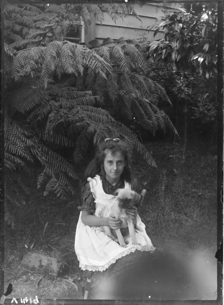 Girl in the garden of The Avenue, Karangahape Road, 1905