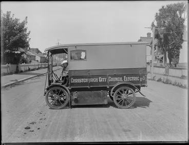 Image: Man and girl in a Walker half-ton electric truck, Christchurch City Council Electric written on side