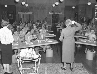 Image: [Dr Silvia Lowrie, beautician, demonstrating Helena Rubinstein's Beauty Through Science programme]