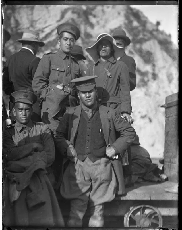 One black and white photograph of a group of people at Tokomaru Bay wharf, taken after 1915.