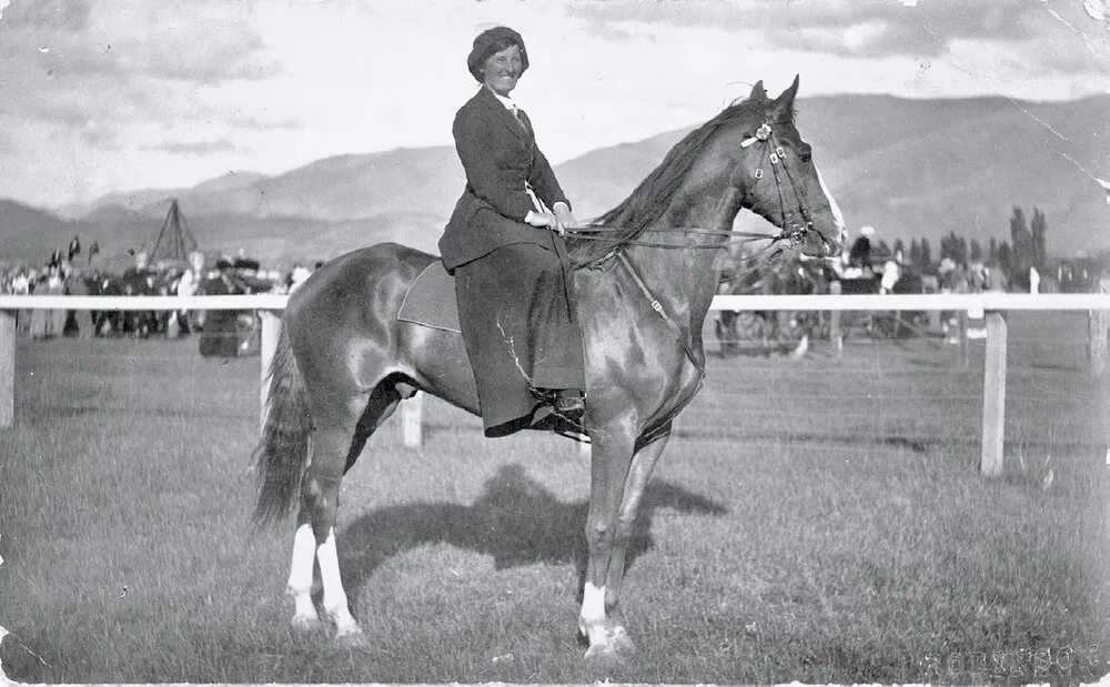 Miss Stewart riding side saddle