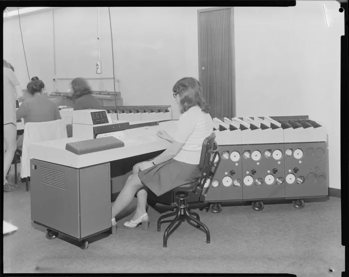 Woman operating large computer