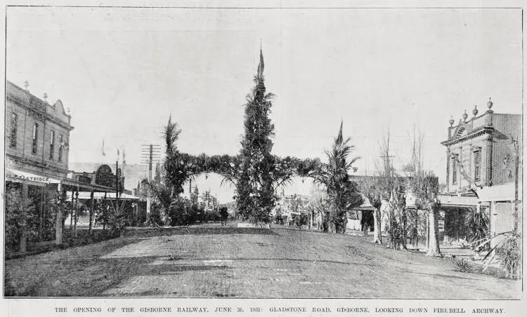 Gladstone Road looking towards the decorated fire bell archway for the opening of the Gisborne-Auckland railway, 26 June 1902