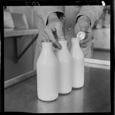 Image: Checking the seal on new bottles, Wellington city milk department