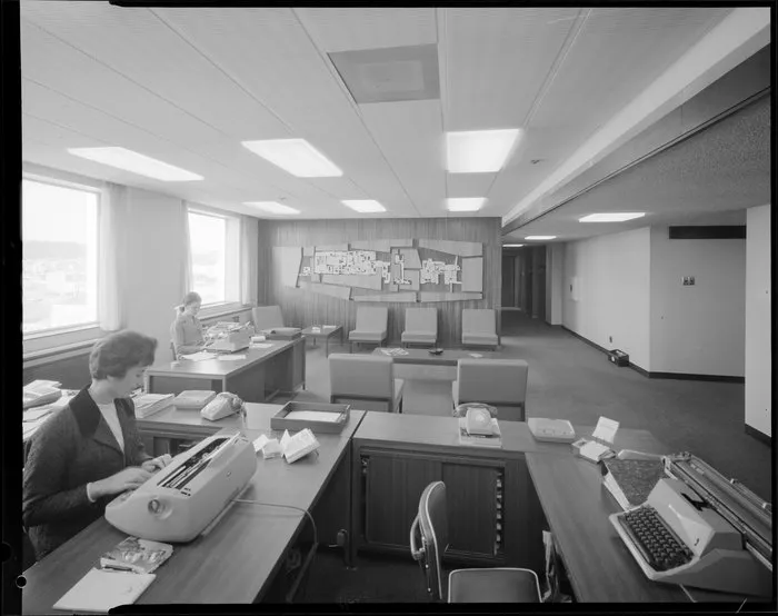 Women at typewriters, unidentified office