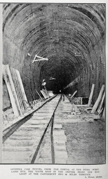 Image: Arthur's Pass tunnel from the portal at the Otira (Westland) end, the white spot in the centre being the day light at the Canterbury end 6 miles through