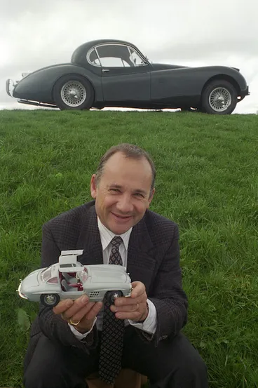 Image: David Wright with a Jaguar XK120 and holding a model of a gull-winged Mercedes - Photograph taken by Melanie Burford