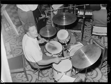 Image: Orchestra rehearsing for a jazz concert, one male drummer with seven drums