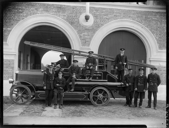 Firemen and fire engine outside Lower Hutt Fire Brigade Station