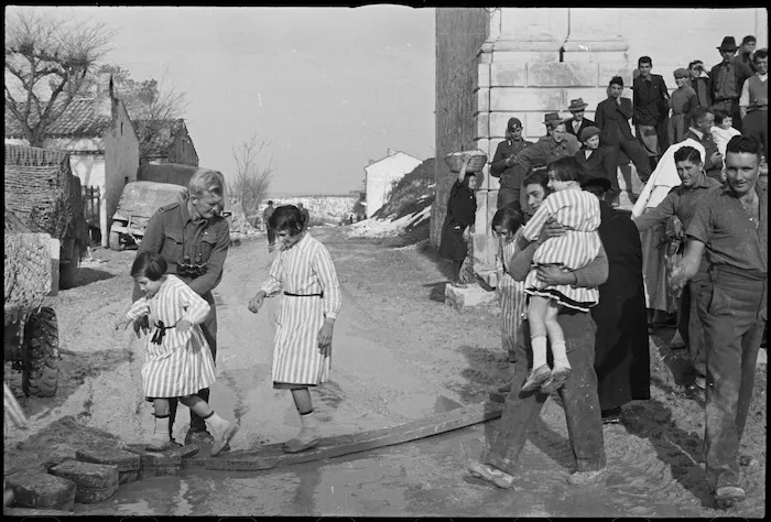 Kiwis fraternizing with orphan children in the village of Castel Frentano, Italy - Photograph by George Kaye