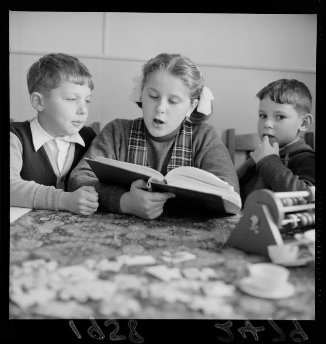 Unidentified Russian children reading at the Russian Embassy, Wellington