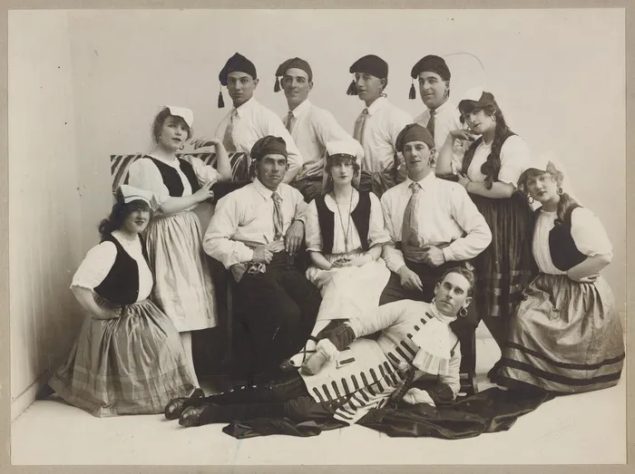 Studio group portrait of theatre performers in costume