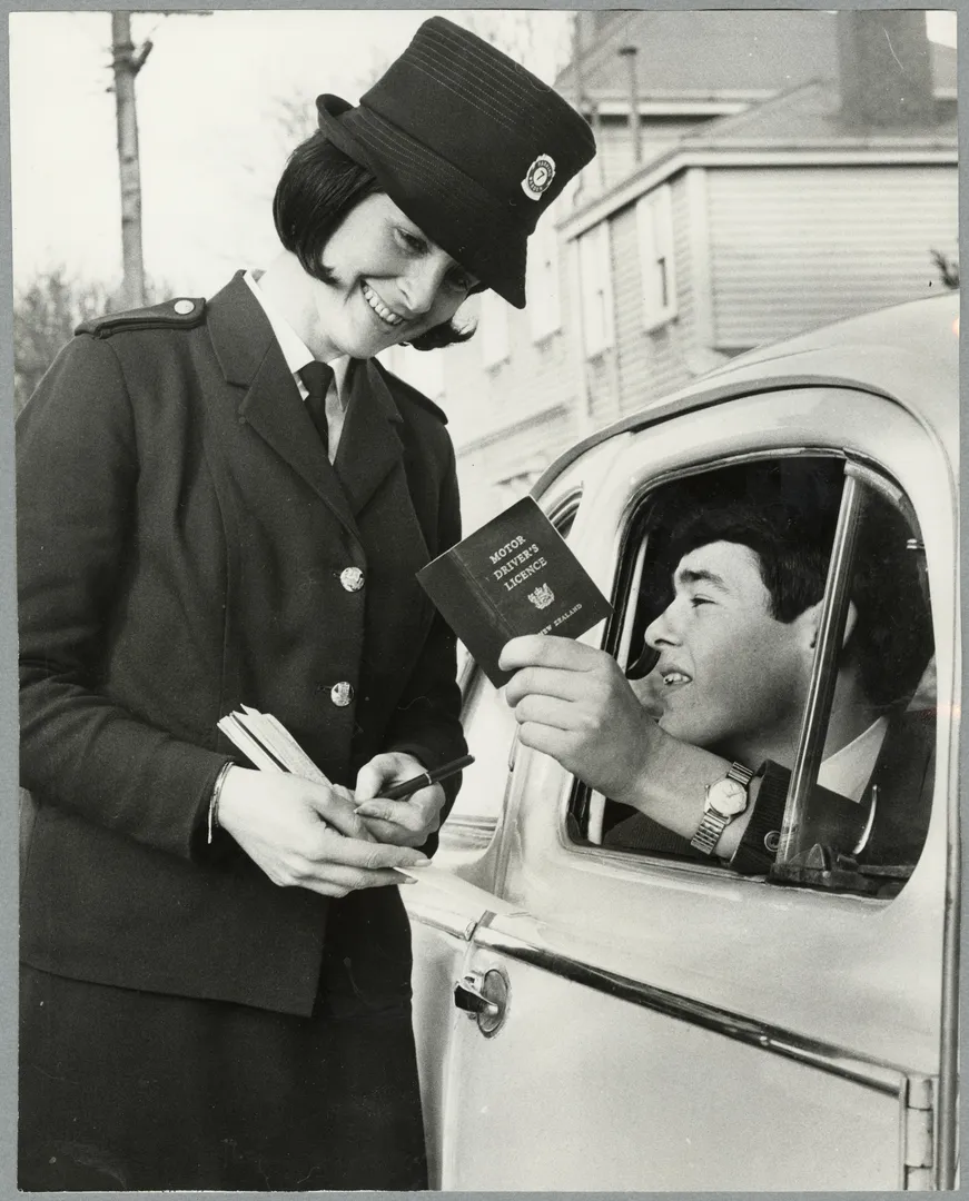 Traffic officer checking a driver's licence
