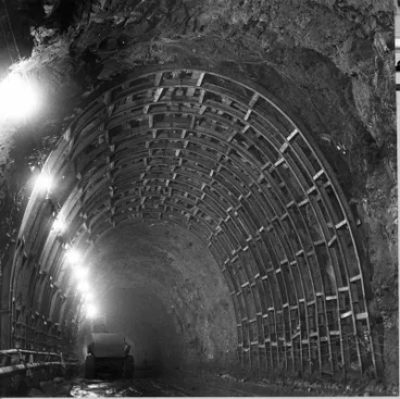 Image: Fletcher Construction Co Ltd, Civil Engineering Division - Christchurch-Lyttelton Road Tunnel: 1962 under construction - strong supports and attempt to rockbolt and wire net tunnel