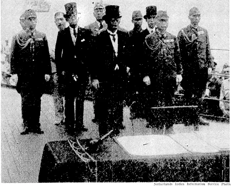 The Japanese delegation stand at attention on the deck of U.S.S. Missouri listening to General Mac Arthur, and awaiting their turn to sign the official surrender document. (Evening Post, 13 September 1945)