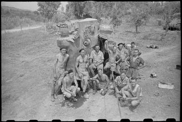 Image: New Zealand Division tank recovery crew alongside recaptured NZ Sherman tank near Florence, Italy, World War II - Photograph taken by George Kaye