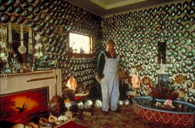 Fred Flutey in his paua shell living room, Bluff. - In Morrison, Robin (1981) The South Island of New Zealand from the road. Special collection, i.e. slides as used in the book or similar in content that the photographer considered his best and most frequently used selection