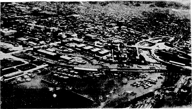An aerial view of Yokohama, Japans principal seaport, which is reported to be blazing merrily after its first heavy fire raid. (Evening Post, 30 May 1945)