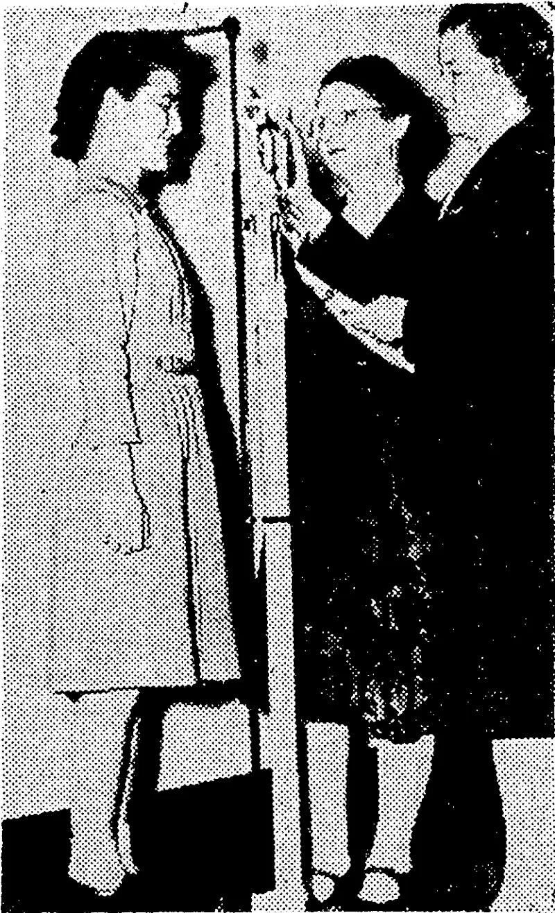Mrs. Tamabo Irene Izumi enrolling in the United States Women's Army Corps, a non-combatant unit. Her husband, who is also Japanese, has been a sergeant with the United States Army Air Force for more than three years. (Evening Post, 11 January 1944)
