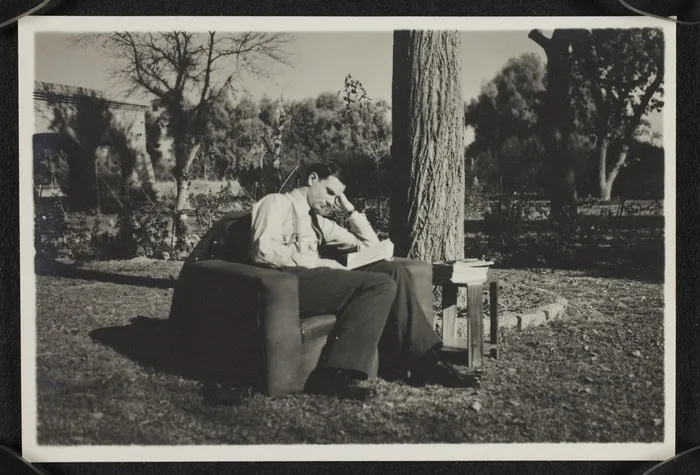 Robert Edward Stout reading in garden in Royal Air Force uniform