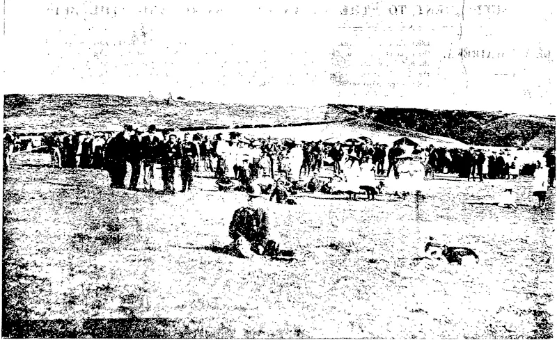 THE WAIREKA BATTLEFIELD. W A Colhs, Photo  A view taken on the occasion of a picnic on the anniversary of the battle. In the foreground is seated Mr. Antonio RodriQuez. a holder of the New Zealand Cross. A cross marks the spot where the Maori fortified pa stood, which Captain Cracroft captured. The other crosses mark the routes taken by the Maoris after being  driven out of the pa into a wooded gully. (Taranaki Herald, 29 March 1902)