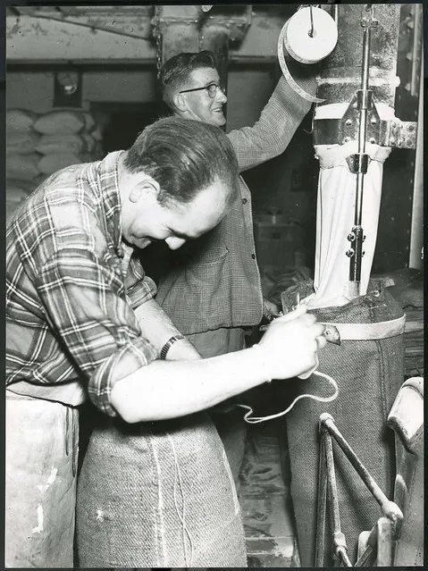 Two men bagging flour at the Crown Milling Company Limited, Dunedin, c1950
