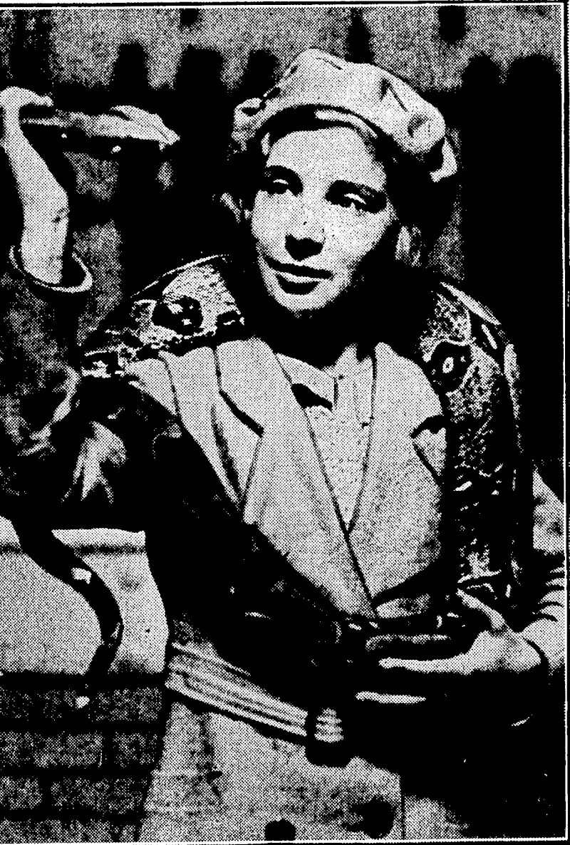 S]iort and General" Photo, AN AMATEUR SNAKE CHARMER.—A little girl from Plymouth, England, recently visited the London Zoo and showed her ability to handle snakes. She is seen with a seven-foot Brazilian boax constrictor over her shoulders: (Evening Post, 03 July 1935)