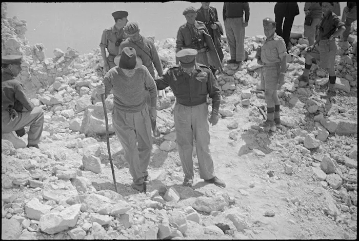 Prime Minister Peter Fraser and General Bernard Freyberg in conversation in ruins of Abbey Cassino, Italy, World War II - Photograph taken by George Kaye