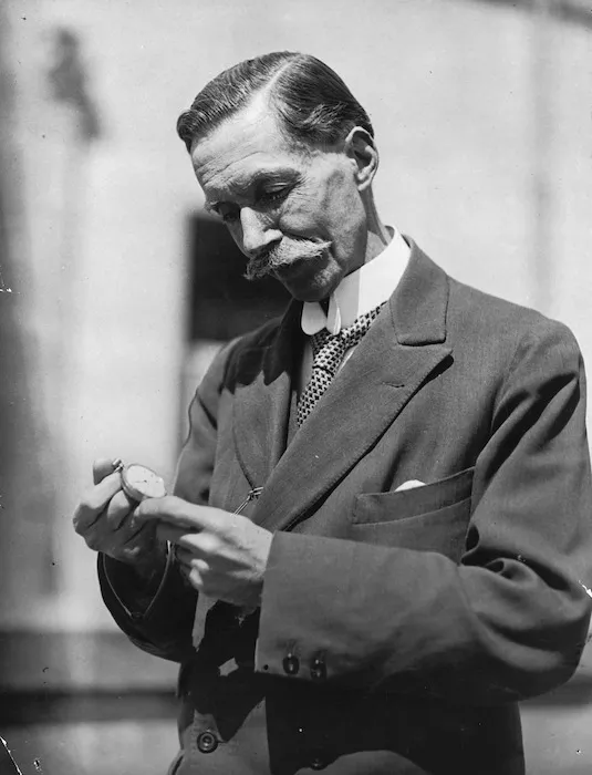 Thomas Kay Sidey holding a watch