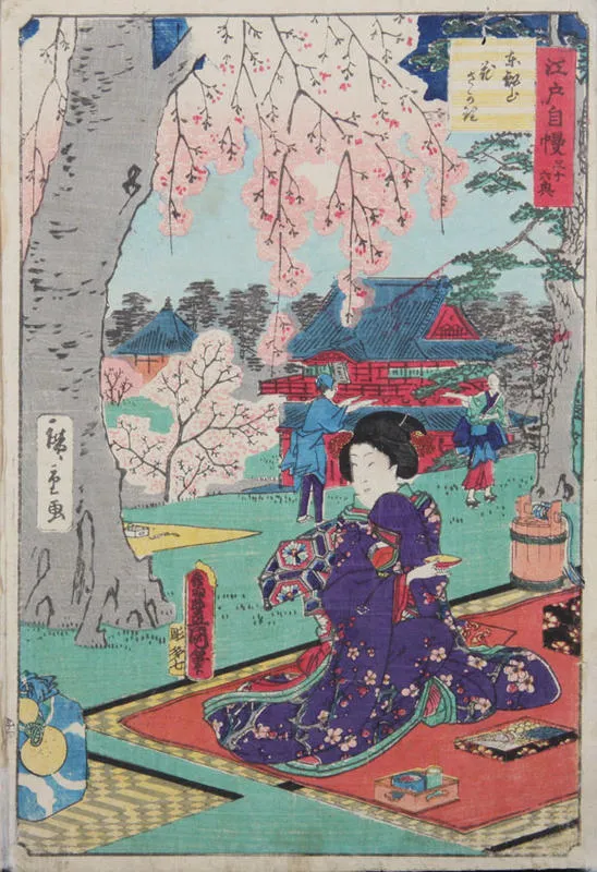 A woman sits picnicing on a carpet on a lawn, holding a bowl