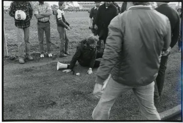 Image: "Tom Newnham (C.A.R.E.) being attacked outside field after game cancelled" - 1981 Springbok Tour