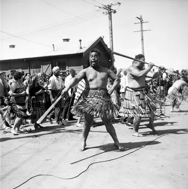 Image: Men wielding taiaha to welcome members of the Maori Battalion