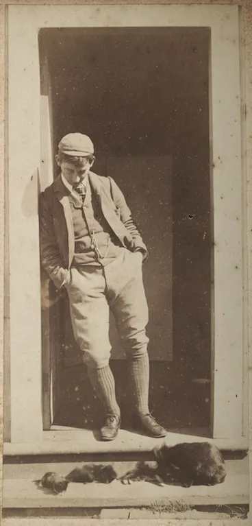 Image: Young man standing in a doorway
