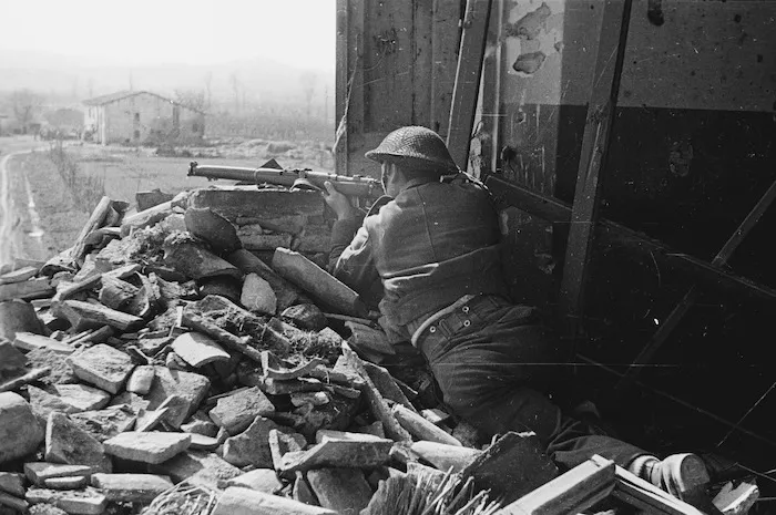 Private E B Jones of the Maori Battalion sniping the enemy just over the Senio River - Photograph taken by J Short