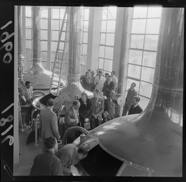 Image: View of unidentified scientists visiting New Zealand Breweries bottling plant, inspecting the fermentation tanks at [Thorndon?], Wellington City
