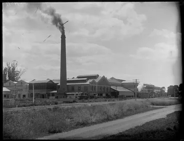 Image: View of The Hawke's Bay Farmer's Freezing Works, Whakatu, showing the freezing works buildings with road and railway in front, Hastings, Hawke's Bay District