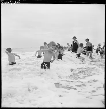 Image: Children from the Otaki Children's Health Camp playing in the surf at Otaki Beach