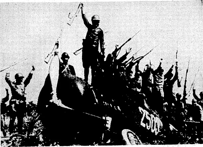 Sport and General" Photo, 'Japanese soldiers- expressing jubilation on the fuselage of a Chinese aeroplane that they had shot down on October-^l4'in^the .of'Shanghai, (Evening Post, 06 November 1937)