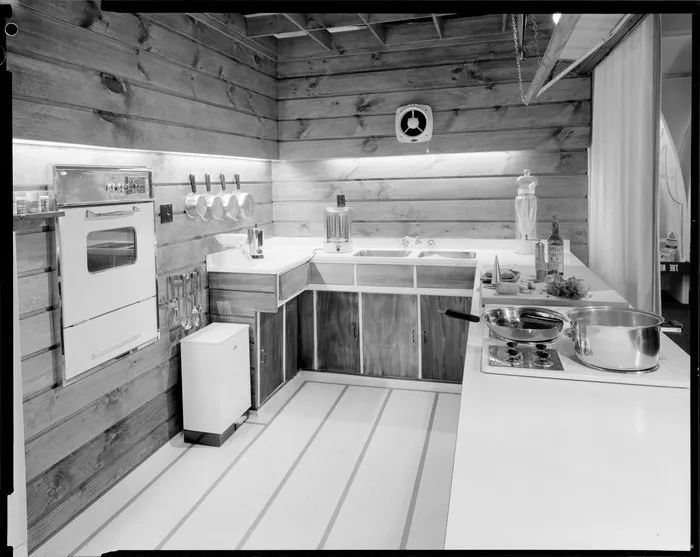 [Studio?] kitchen, with ingredients and equipment ready for use, possibly a cooking demonstration