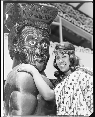 Image: Unidentified Maori woman and pou, Te Puea Marae, Mangere, Auckland