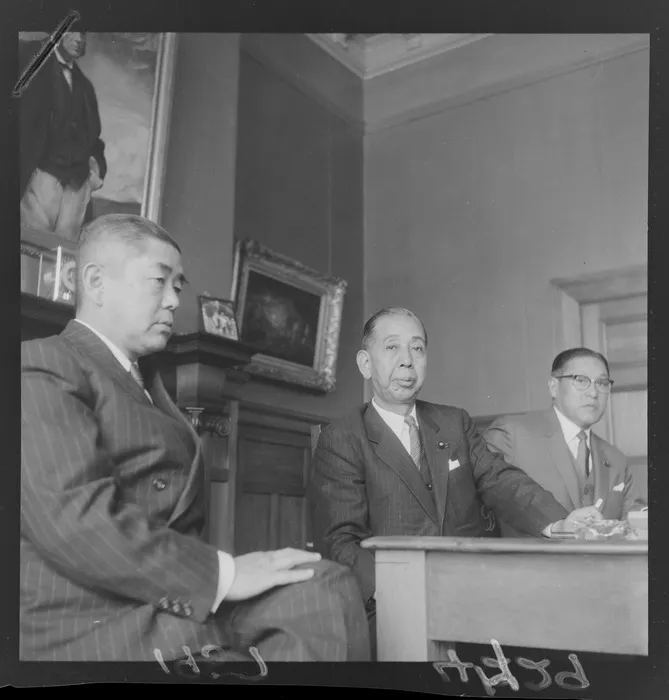The Prime Minister of Japan, Mr Nobusuke Kishi, with officials