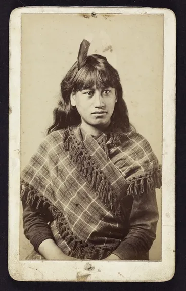 Image: Photographer unknown: Portrait of female Māori subject wearing huia feather