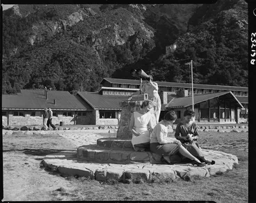 Image: Women by a binocular viewer outside The Hermitage, Mount Cook - Photograph taken by D Nicholson