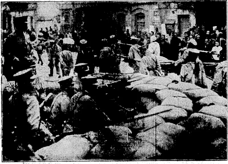 3' outrages by the[Southerners on' Japanese residents In China,' at Tsinan and its vicinity, refultsd In the occu£ • nation of esrUln places by Japanese troops. In tht photofraph Northern Chinese troops are soon passing In front of *'■'•-■-■ ■■'?■■'■■■:(, a( Japanese barricade In Tsinan. (Evening Post, 07 July 1928)